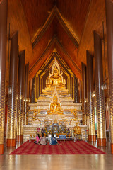 Wat Dhammayan, Buddha statues are enshrined in the pavilion around the chapel at a Buddhist temple in Phetchabun Province, Thailand.