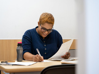 Fashionable Indian lady working at her desk
