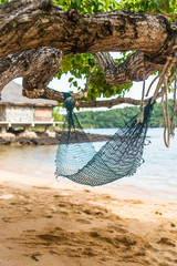 Empty hammock on the beach in day time