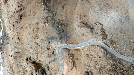 Natural Atmosphere of Leh Ladakh City, Jammu, north of India in Winter. Rock Mountain with Snow cover to Himalayas mountains, one of Highest road in the world. Photo from aerial view by drone.