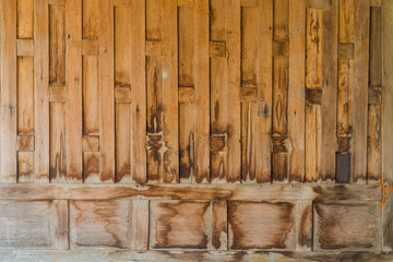 Very old weathered hardwood panel wall close up