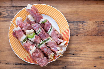 raw meat with herbs and garlic for grill on dish