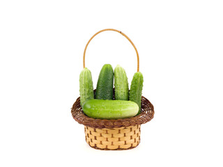 Cucumbers in a basket on a white background