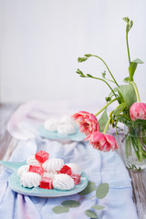 marshmallows and red marmalade in a blue plate