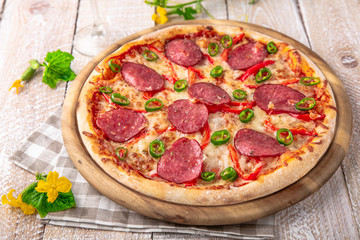 Pepperoni or Diablo pizza on white boards with a glass of wine. Menu cover