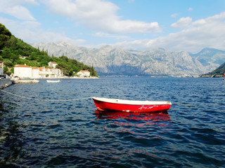 Fototapeta na wymiar Kotor Bay and coastline in Perast city, Perast is a small town that features one street just near the sea in the Bay of Kotor near Kotor city in Montenegro.