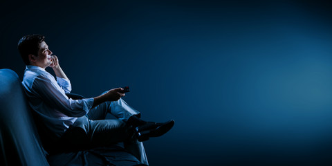 Businessman watching TV