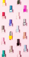 Nail polish bottles pattern background. Close up.