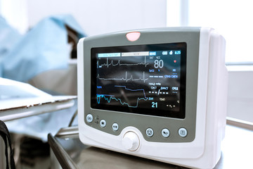 Heart rate monitor in hospital theater. Medical vital signs monitor instrument in a hospital on anesthesia surgery monitor. ECG Patient Monitor. medical electronics - obrazy, fototapety, plakaty