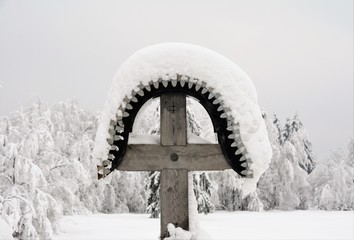 a cross covered with snow