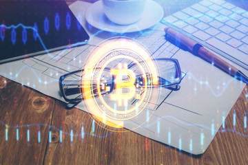 Crypto theme hologram with glasses on the table background. Concept of blockchain. Double exposure.