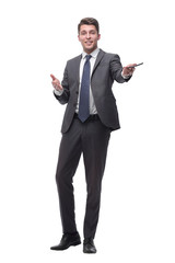 friendly successful businessman with a smartphone . isolated on grey background