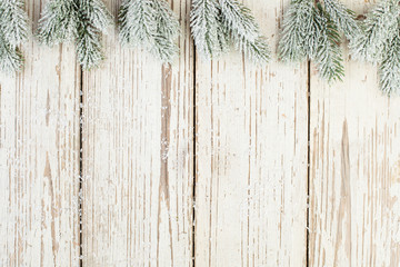 Christmas green fir composition border flat lay top view. Green fir branch on white wooden background