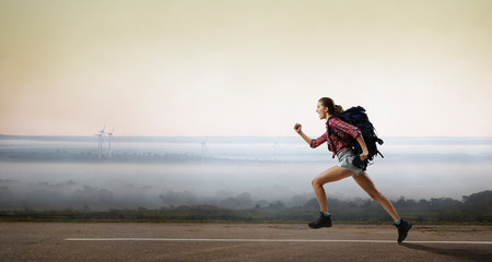 Travelling female tourist with backpack
