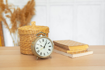 Close up of vintage alarm clock on wooden table