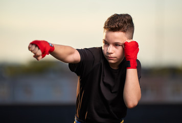 Young fighter training on the roof