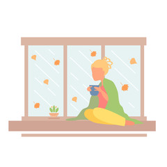 Obraz na płótnie Canvas Girl is drinking coffee on a rainy day