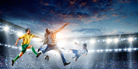 Soccer man in action with ball. Mixed media