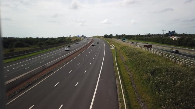 Traffic on the M8 motorway near the Showcase Leisure Park at Coatbridge. Filmed from a pedestrian footbridge.