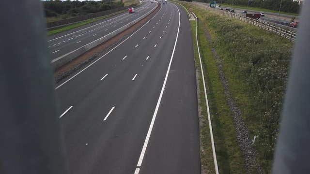 Traffic on the M8 motorway near the Showcase Leisure Park at Coatbridge. Filmed from a pedestrian footbridge.