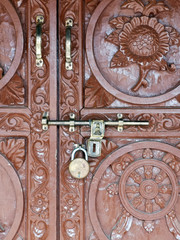 Fototapeta na wymiar Lock system on a decorated door in Nepal