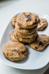 Paleo Chocolate Chip Cookies Made with Coconut and Almond Flour on Baking Sheet / Paper.