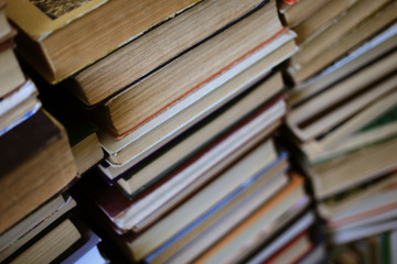 old books lie one on one on the table