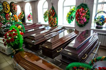 Shop selling coffins and funeral wreaths. Sale of funeral accessories