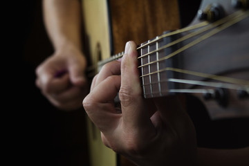 Acoustic Guitar Player Performing. Guitarist Playing In Music Studio