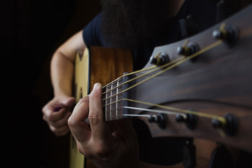 Acoustic Guitar Player Performing. Guitarist Playing In Music Studio