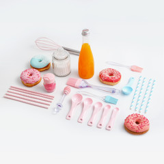 Composition of donuts, sweets and kitchen utensils for their preparation