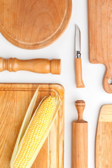 Composition of wooden cutting boards and wooden utensils and kitchen utensils. Top view.