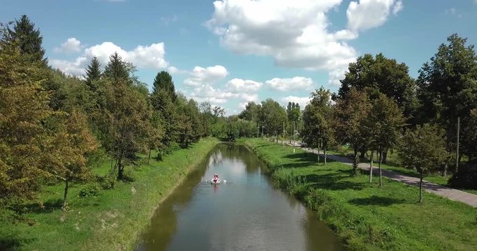 Family on a boat floating on the river.