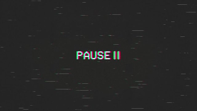 A capture of a VCR playing and pausing a VHS blank tape: the text Pause, appearing with a blinking symbol, at the center of the screen. Digital remake, regular size.