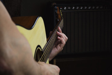 Acoustic Guitar Player Performing. Guitarist Playing In Music Studio