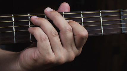 Acoustic Guitar Player Performing. Guitarist Playing In Music Studio
