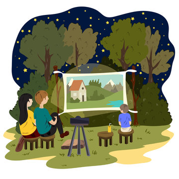 A young couple and a little boy are watching an outdoor movie. Street cinema
