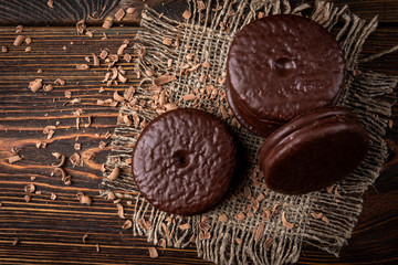 Chocolate cookies on dark wooden background. Chocolate pie.