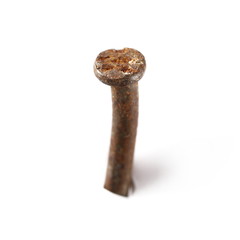 Old, rusty iron, metal hammered nail isolated on white background