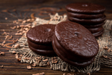Chocolate cookies on dark wooden background. Chocolate pie.