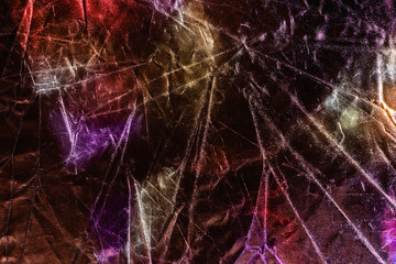 Textured silver foil background with shiny crumpled surface in trendy colors.