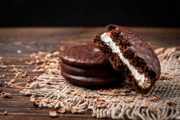 Chocolate cookies on dark wooden background. Chocolate pie.