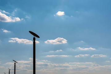 city lanterns with reflectors on sky background