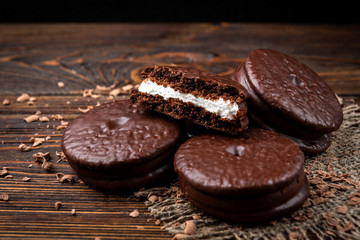 Chocolate cookies on dark wooden background. Chocolate pie.