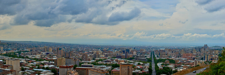 Fototapeta na wymiar view of the city of Yerevan from the observation deck on a sunny day with clouds in the sky.