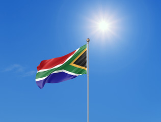 3D illustration. Colored waving flag of South Africa on sunny blue sky background.