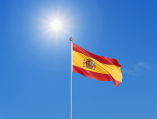 3D illustration. Colored waving flag of Spain on sunny blue sky background.