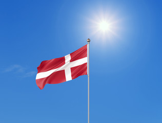 3D illustration. Colored waving flag of Denmark on sunny blue sky background.