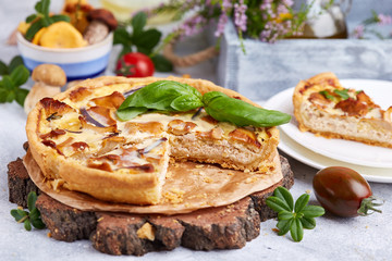 Quiche – open tart pie with chicken meat, forest mushrooms, onion and cheese 