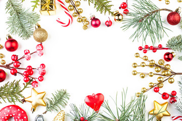 Christmas or winter background. Frame made of fir branch, red berries and decoration. Christmas and new year composition, flat lay, top view with copy space